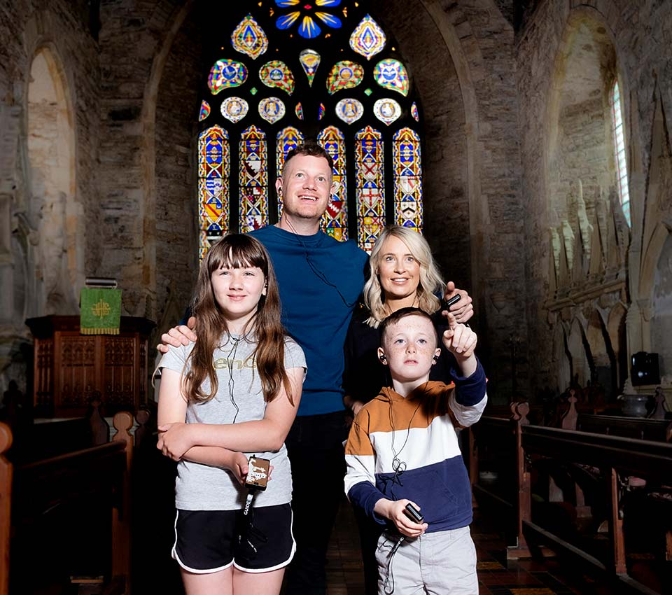 A family standing in St Mary's Collegiate Church.