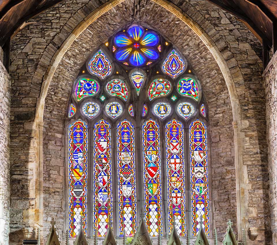 The stained-glass window in St Mary's Collegiate Church.